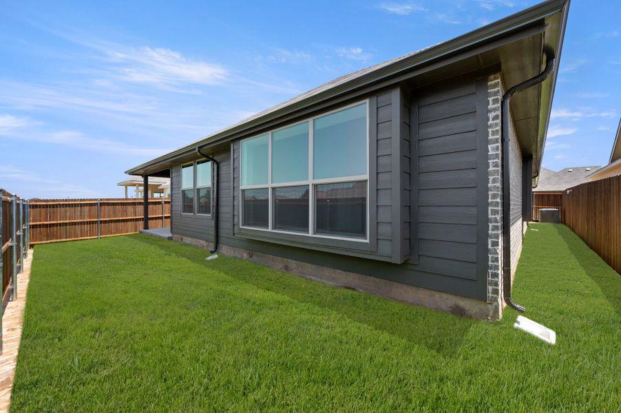 Exterior details and patio area of a home in Pirate Village, Granbury (Image 19).