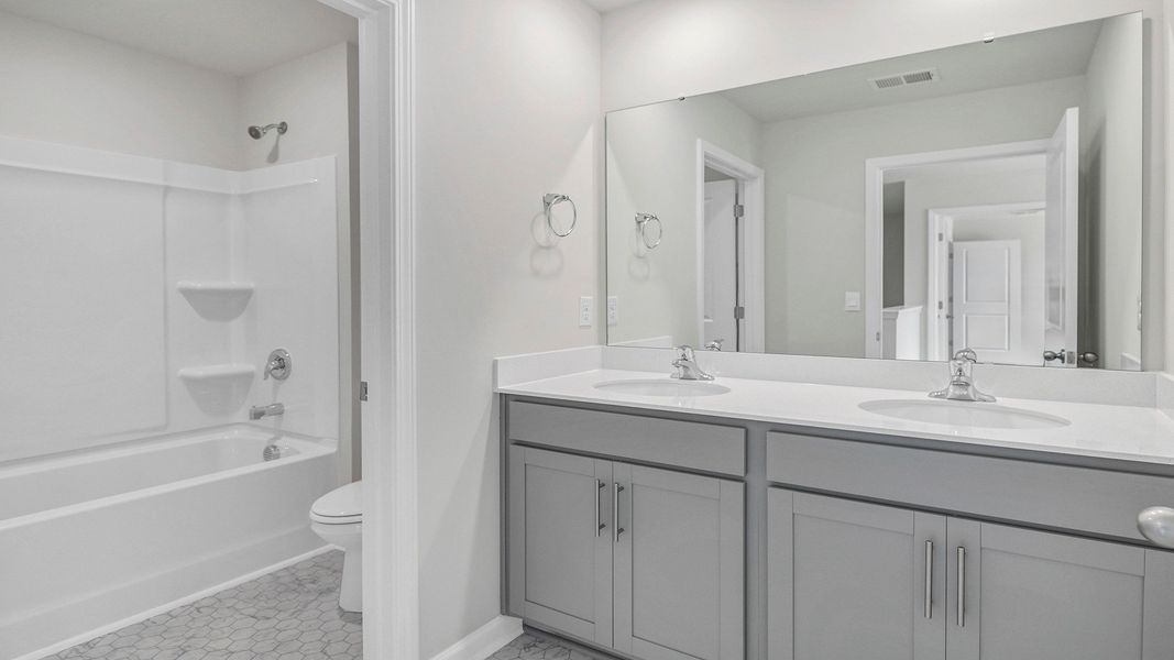 Representative furnished interior of a home built from the MANNING by D.R. Horton in Sease's Pond, Gilbert (Image 9).