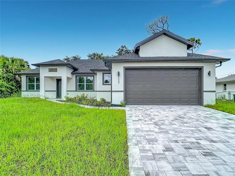 Front exterior of a new home in , North Port, FL, highlighting curb appeal (Image 25).