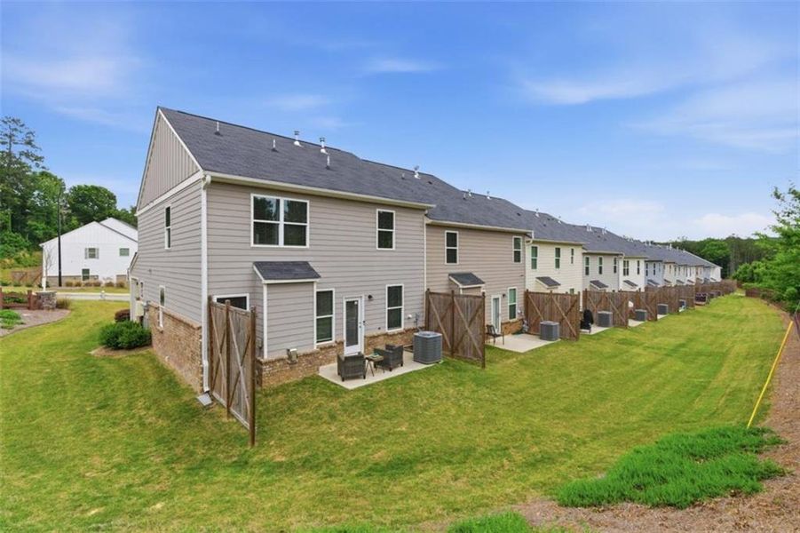 Exterior details and patio area of a home in Park Center Pointe, Mableton (Image 28).