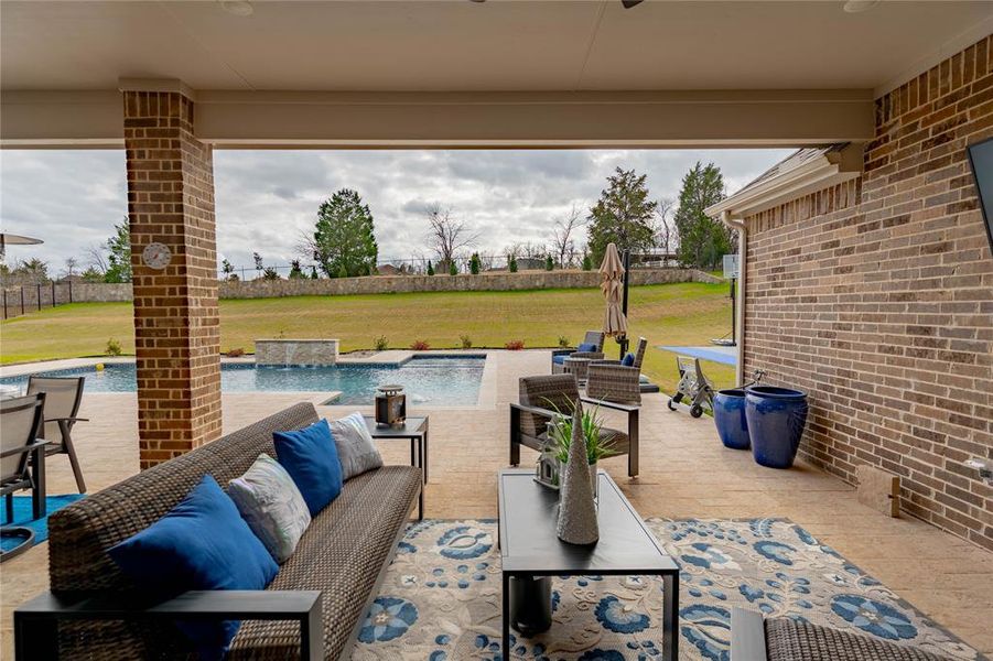 View of patio featuring an outdoor living space, an outdoor pool, and a ceiling fan