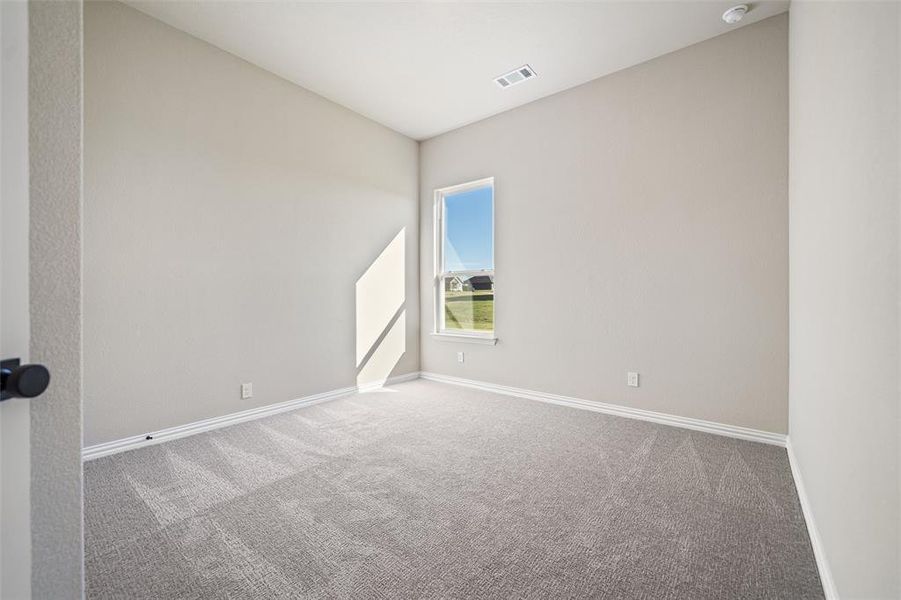Empty room with carpet flooring