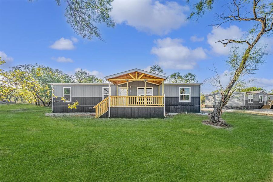 Front exterior of a new home in , Bridgeport, TX, highlighting curb appeal (Image 2). Front exterior of a new home in , Bridgeport, TX, highlighting curb appeal (Image 2).
