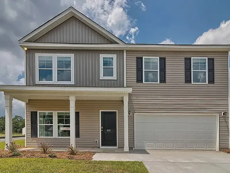 Front exterior of a new home in Emanuel Creek, West Columbia, SC, highlighting curb appeal (Image 1). Front exterior of a new home in Emanuel Creek, West Columbia, SC, highlighting curb appeal (Image 1).