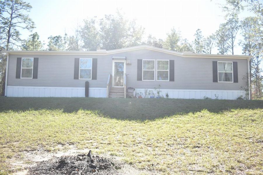 Exterior details and patio area of a home in , Williston (Image 32).
