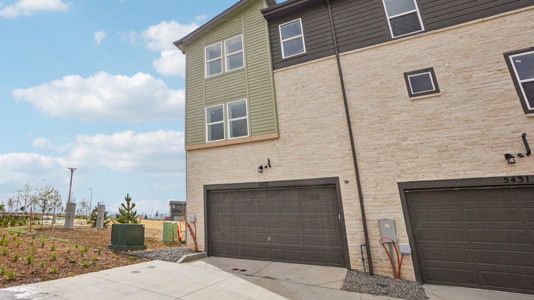 Front exterior of a new home in Windler Townhomes, Aurora, CO, highlighting curb appeal (Image 2). Front exterior of a new home in Windler Townhomes, Aurora, CO, highlighting curb appeal (Image 2).