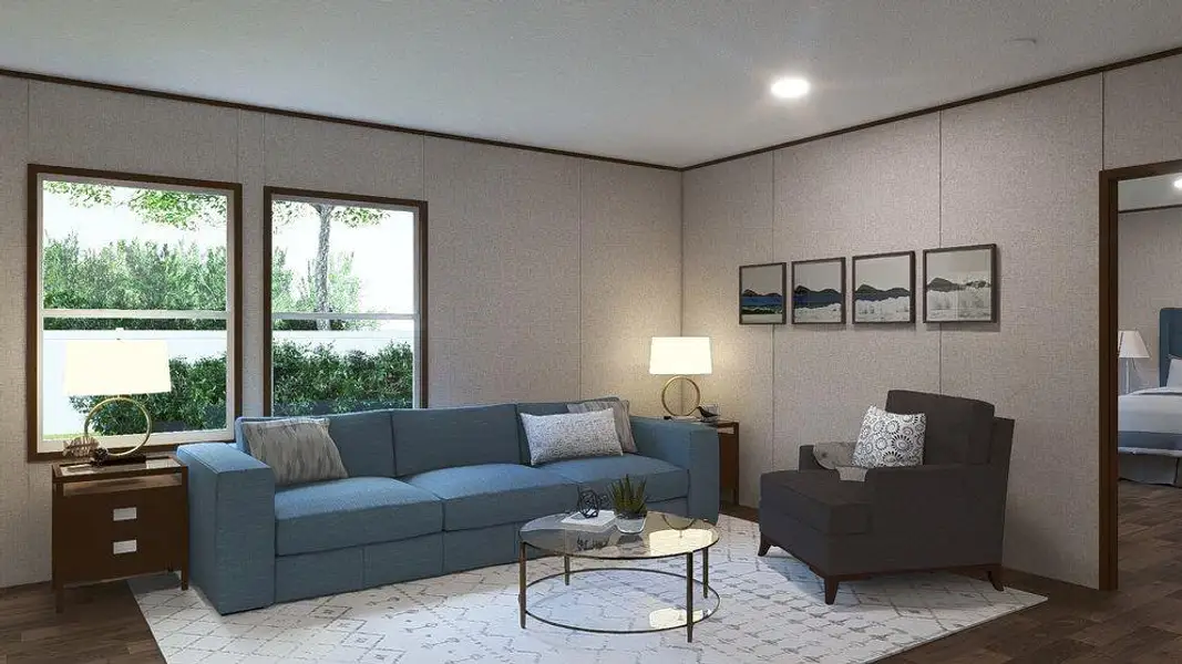 Spacious living area featuring wood-finish flooring, two large windows, recessed ceiling lighting, and a doorway opening to an additional room Spacious living area featuring wood-finish flooring, two large windows, recessed ceiling lighting, and a doorway opening to an additional room