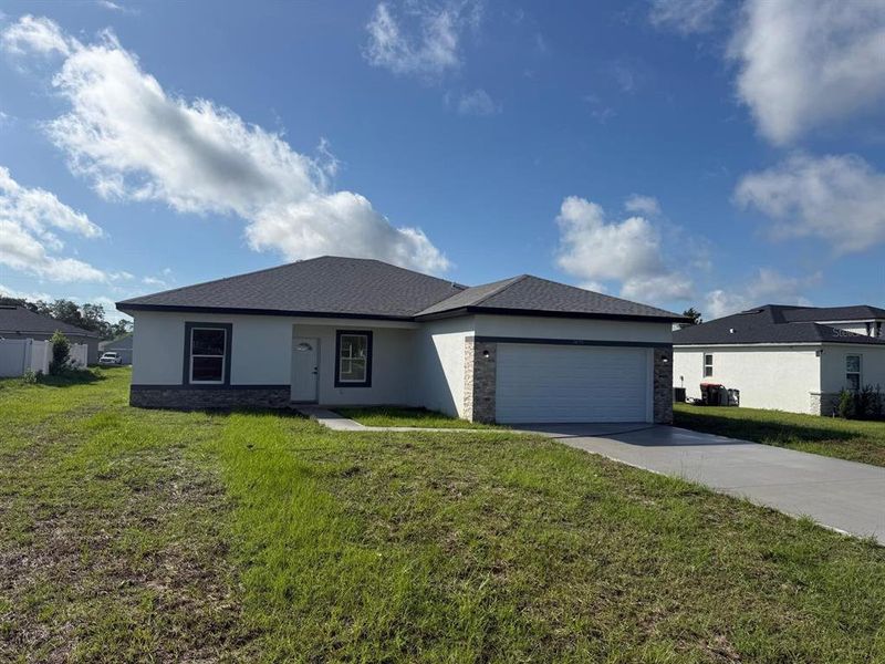 Front exterior of a new home in , Ocala, FL, highlighting curb appeal (Image 20).