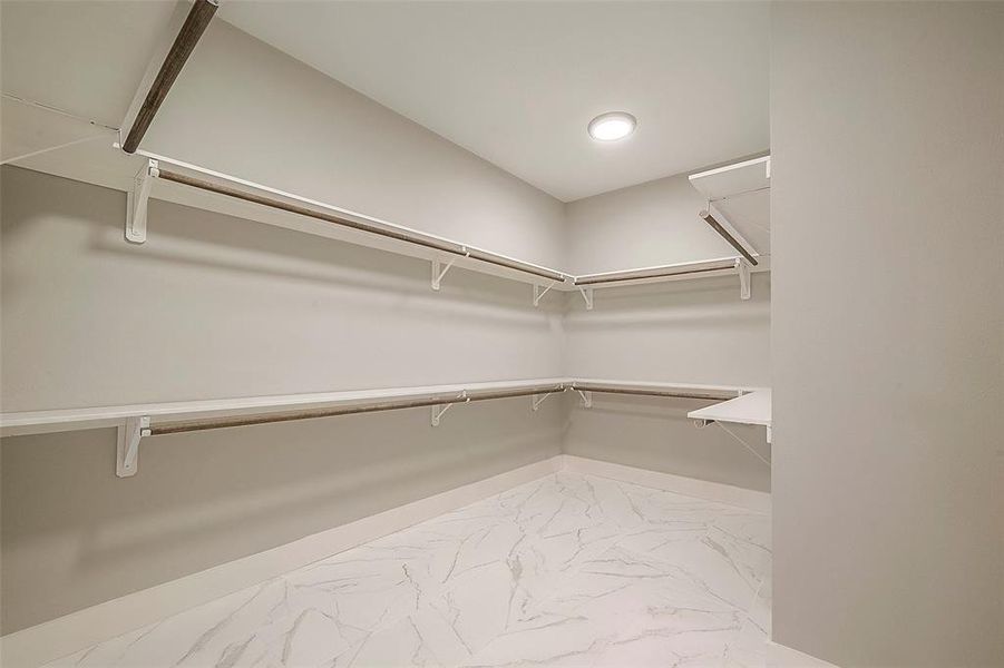 Spacious walk in closet in primary bedroom