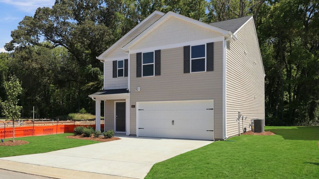 Front exterior of a new home in Carter Ridge, Greenville, NC, highlighting curb appeal (Image 2). Front exterior of a new home in Carter Ridge, Greenville, NC, highlighting curb appeal (Image 2).