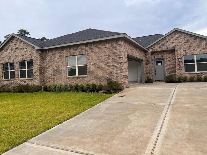 Front exterior of a new home in , Spring, TX, highlighting curb appeal (Image 19).