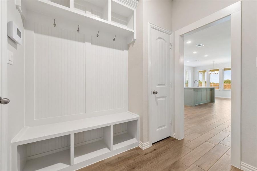 Mudroom featuring light wood-type flooring and recessed lighting Mudroom featuring light wood-type flooring and recessed lighting