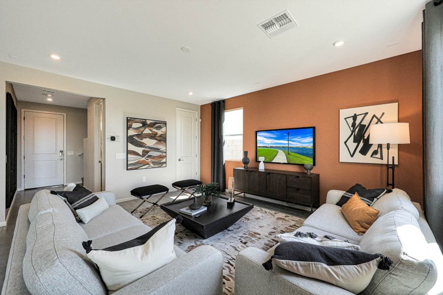 A living room with a tv and couches.