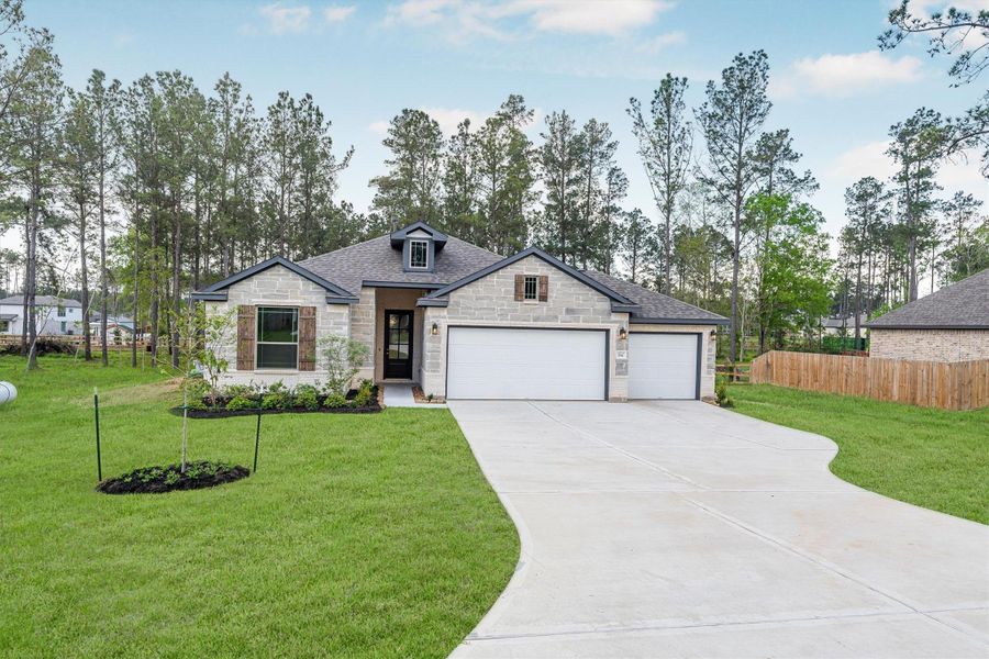 Front exterior of a new home in Deer Pines, Conroe, TX, highlighting curb appeal (Image 24).