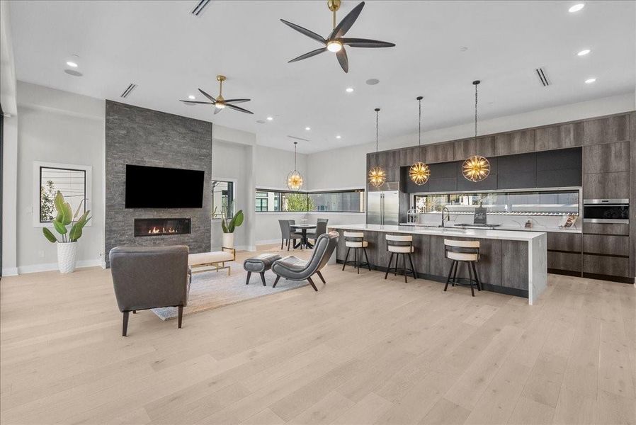 An oversized quartz island seats six and pairs beautifully with Wolf appliances and a Sub-Zero refrigerator — all included.