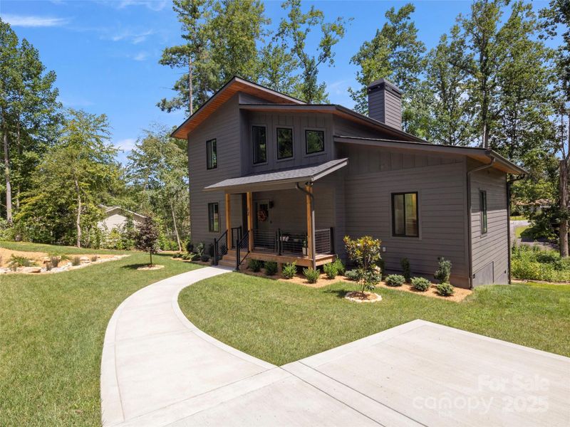 Front exterior of a new home in , Hendersonville, NC, highlighting curb appeal (Image 21).
