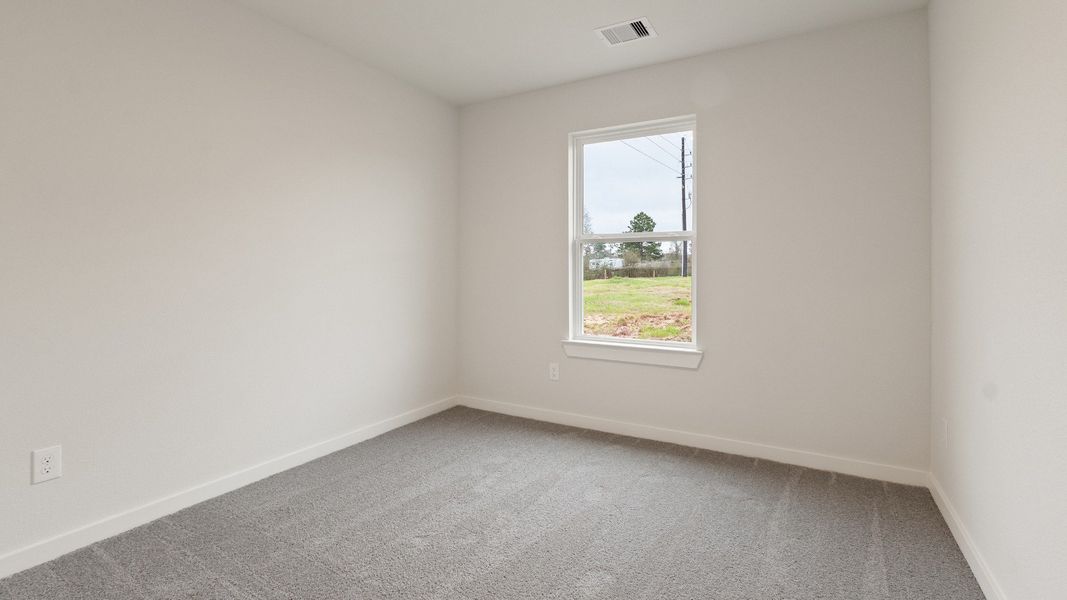 Representative furnished interior of a home built from the Driskill by Brightland Homes in Sunterra, Katy (Image 13).