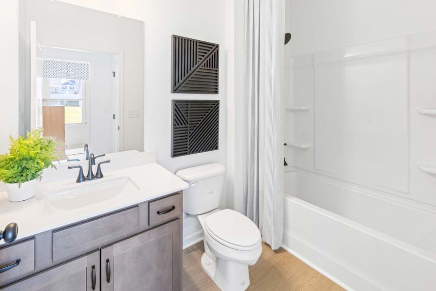 **These photos are examples of a different home with the same floorplan. Interior and exterior may differ.**