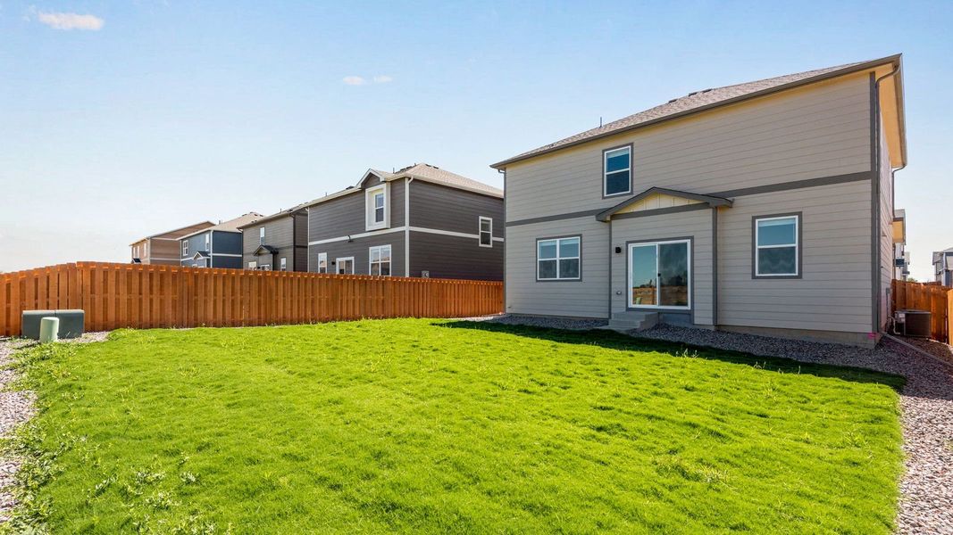 Exterior details and patio area of a home in Vista Meadows, Fort Lupton (Image 18).