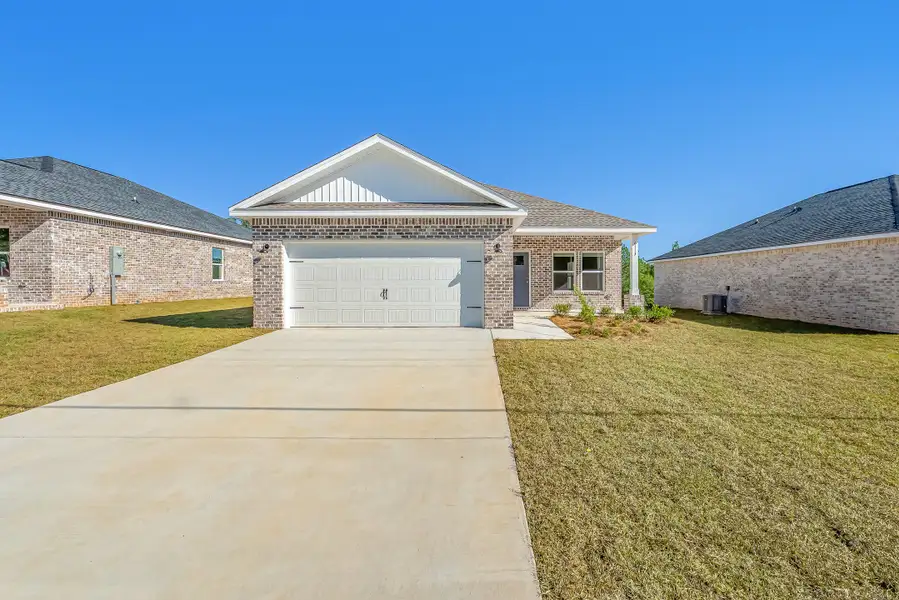 Front exterior of a new home in McCarthy Estates, Defuniak Springs, FL, highlighting curb appeal (Image 1). Front exterior of a new home in McCarthy Estates, Defuniak Springs, FL, highlighting curb appeal (Image 1).
