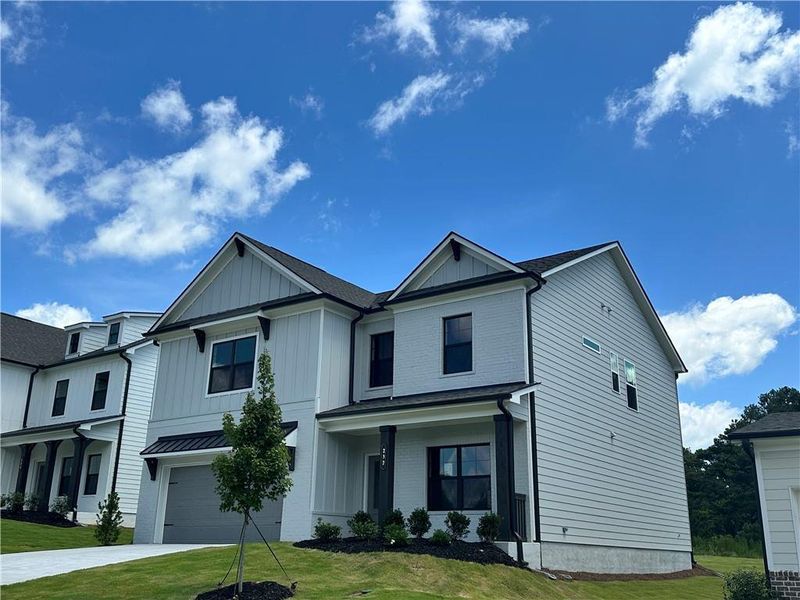 Front exterior of a new home in Summerlin, Winder, GA, highlighting curb appeal (Image 18).