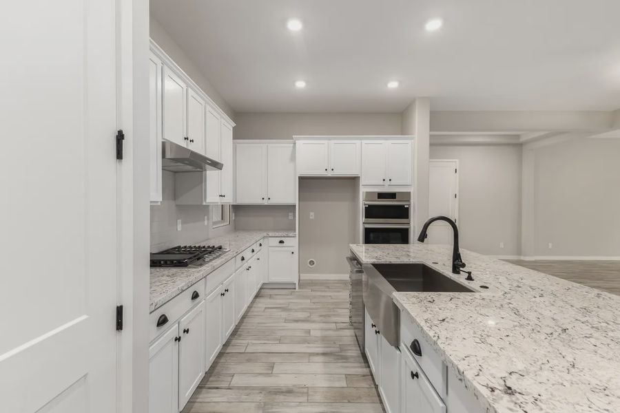 Furnished interior view inside a new home in Valencia at Granite Vista, Waddell (Image 9).