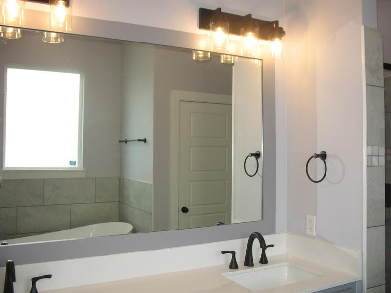 Bathroom with a freestanding tub and double vanity