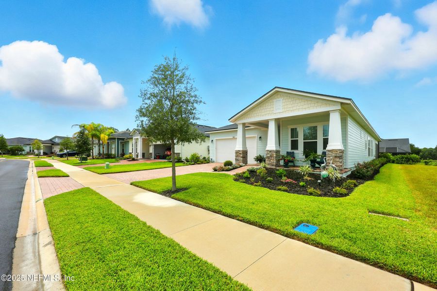 Front exterior of a new home in Reverie at TrailMark, St. Augustine, FL, highlighting curb appeal (Image 19). Front exterior of a new home in Reverie at TrailMark, St. Augustine, FL, highlighting curb appeal (Image 19).