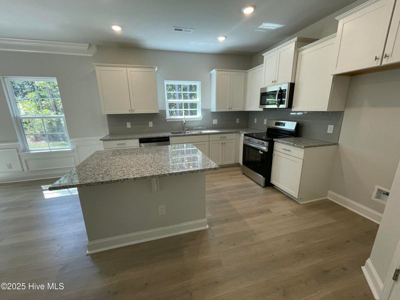 Furnished interior view inside a new home in Mill Creek Cove, Bolivia (Image 6).