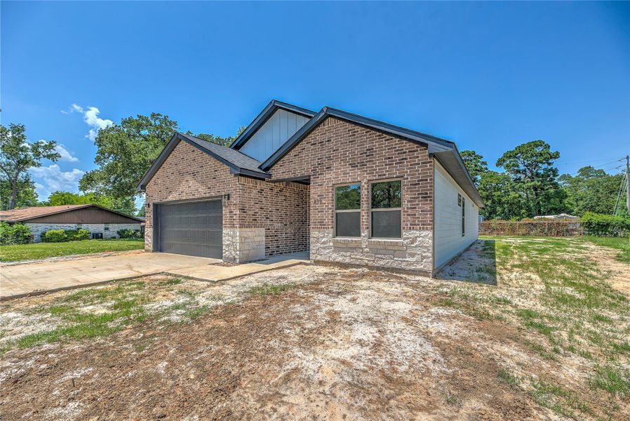 Front exterior of a new home in , Livingston, TX, highlighting curb appeal (Image 18). Front exterior of a new home in , Livingston, TX, highlighting curb appeal (Image 18).