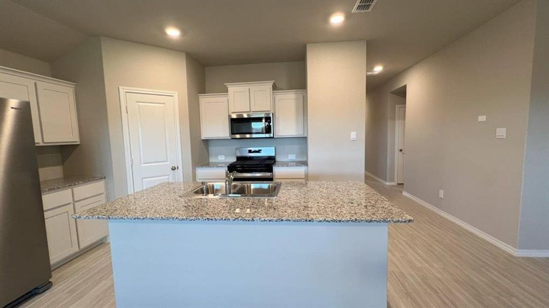 Kitchen- All Home and community information, including pricing, included features, terms, availability and amenities, are subject to change at any time without notice or obligation. All Drawings, pictures, photographs, video, square footages, floor plans, elevations, features, colors and sizes are approximate for illustration purposes only and will vary from the homes as built Kitchen- All Home and community information, including pricing, included features, terms, availability and amenities, are subject to change at any time without notice or obligation. All Drawings, pictures, photographs, video, square footages, floor plans, elevations, features, colors and sizes are approximate for illustration purposes only and will vary from the homes as built