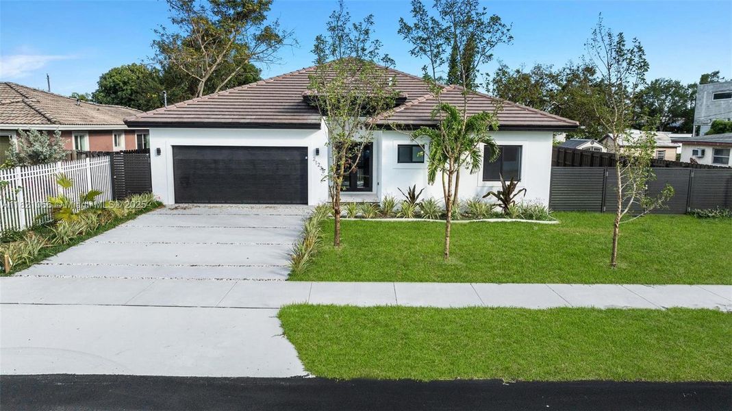 Front exterior of a new home in , Cutler Bay, FL, highlighting curb appeal (Image 19).