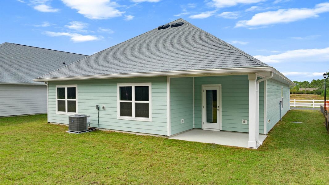 Exterior details and patio area of a home in Buffer Farms, Port Saint Joe (Image 2).