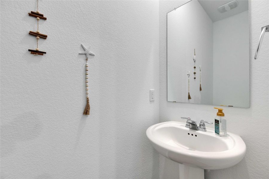 Half Bathroom next to Laundry room downstairs. Half Bathroom next to Laundry room downstairs.