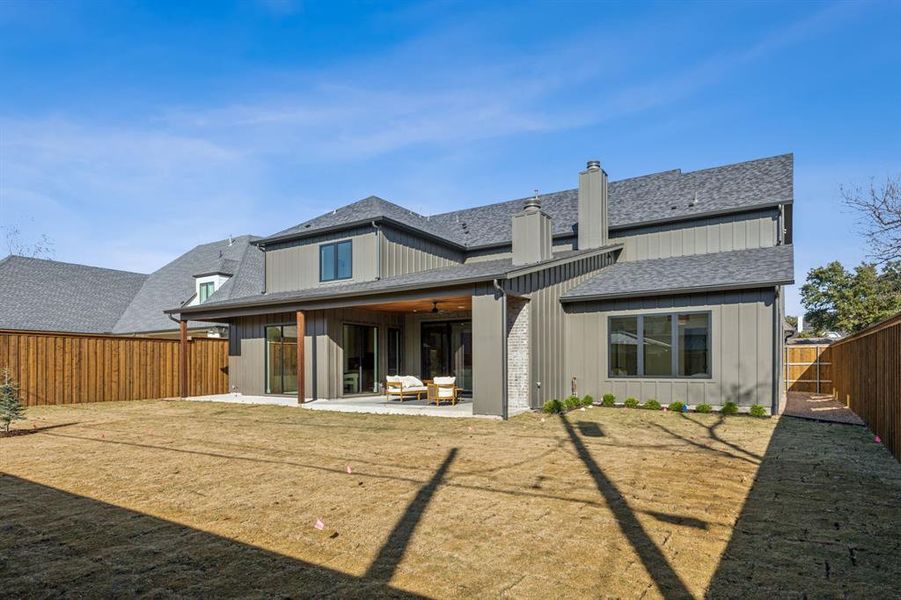 Rear view of house with a patio