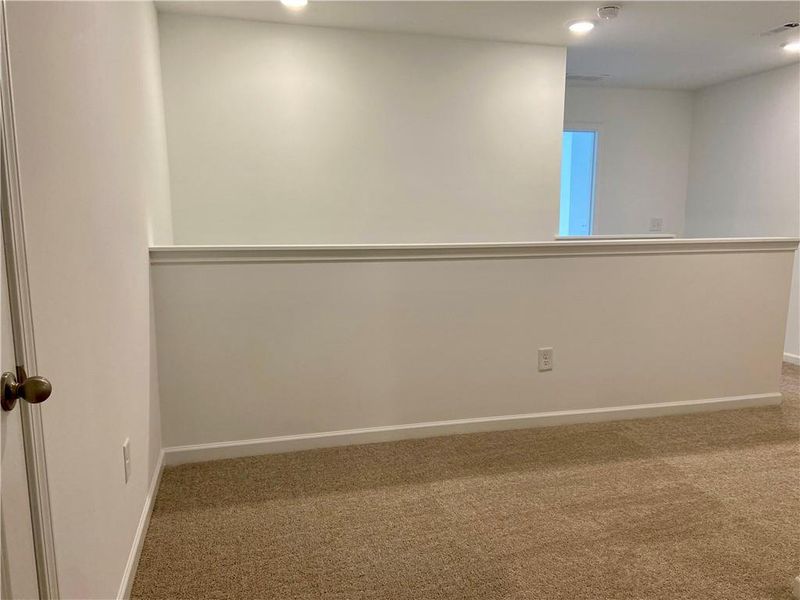 Spacious, unfurnished interior of a new home in Eastlyn Crossing, Flowery Branch (Image 16).