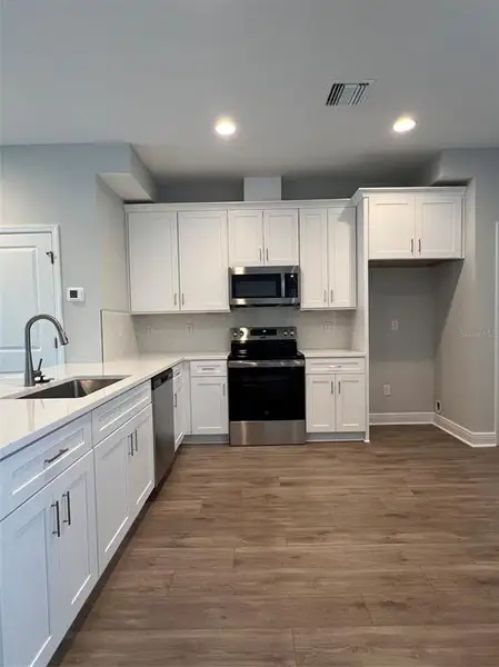 Furnished interior view inside a new home in The Towns At Long Bayou, Seminole (Image 6).