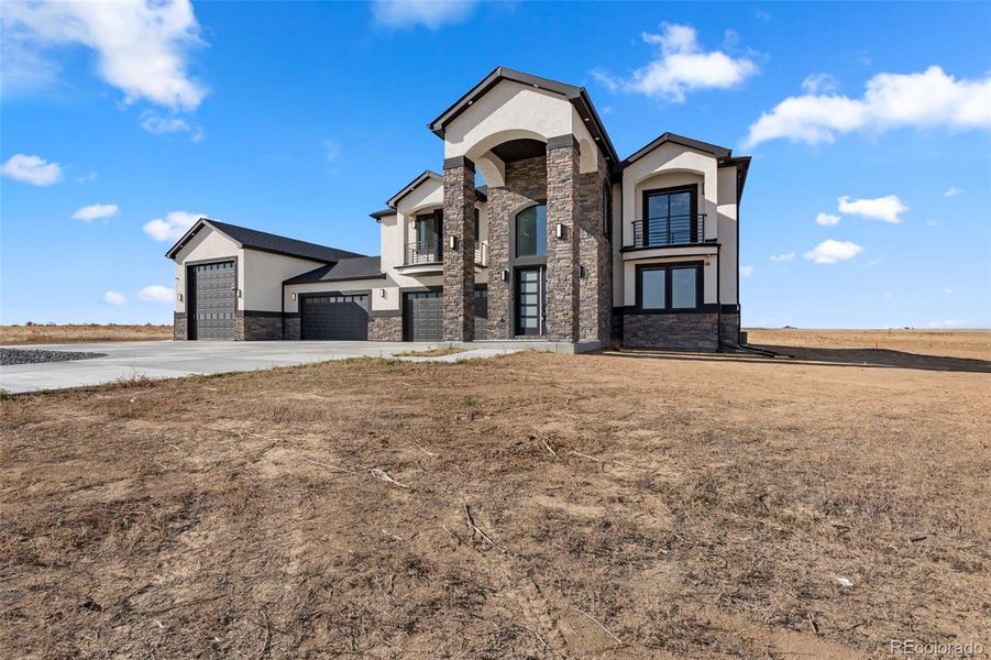 Front exterior of a new home in , Hudson, CO, highlighting curb appeal (Image 25).