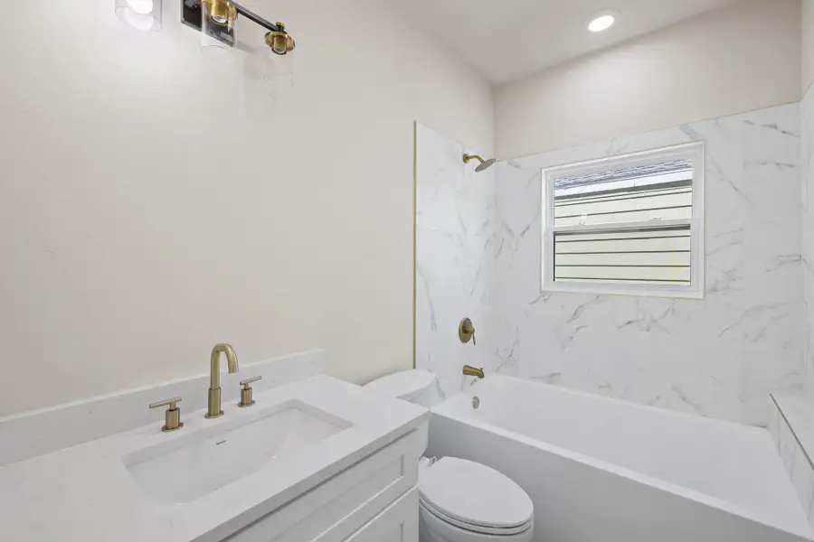 Bathroom featuring vanity and shower / tub combination Bathroom featuring vanity and shower / tub combination