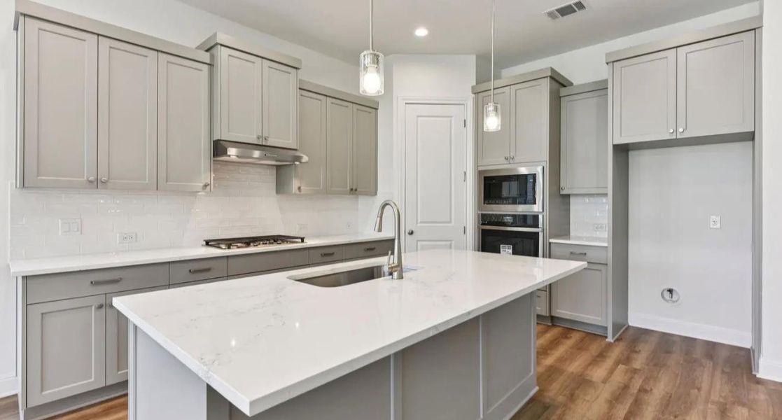 Furnished interior view inside a new home in 6 Creeks, Kyle (Image 5).