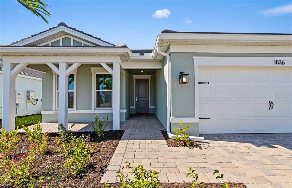 Exterior details and patio area of a home in Shores at Stillwater, Englewood (Image 4).