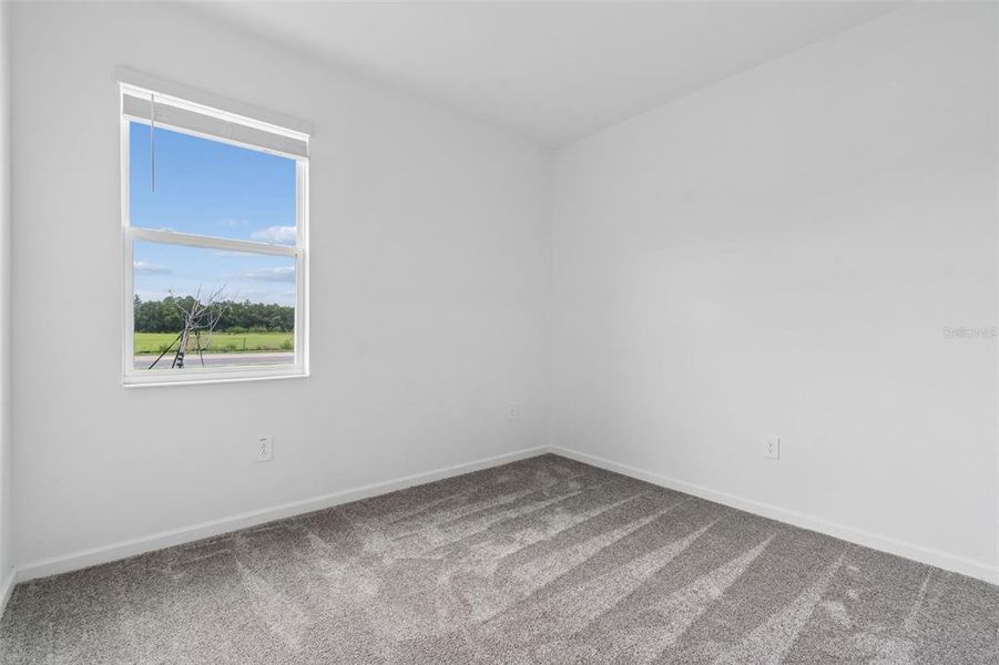Spacious, unfurnished interior of a new home in Peace Creek Reserve, Winter Haven (Image 21).