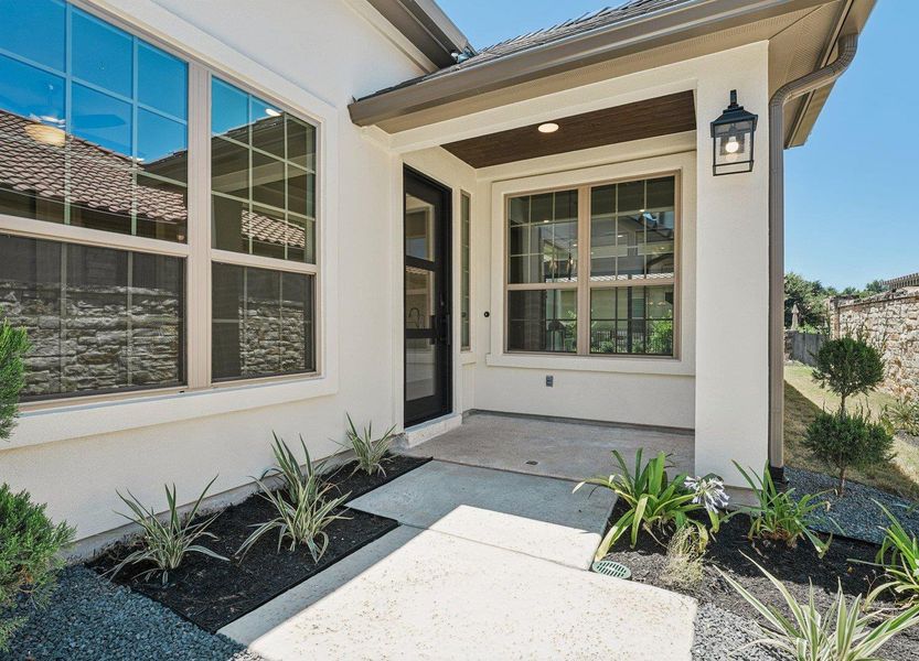 Doorway to property with stucco siding