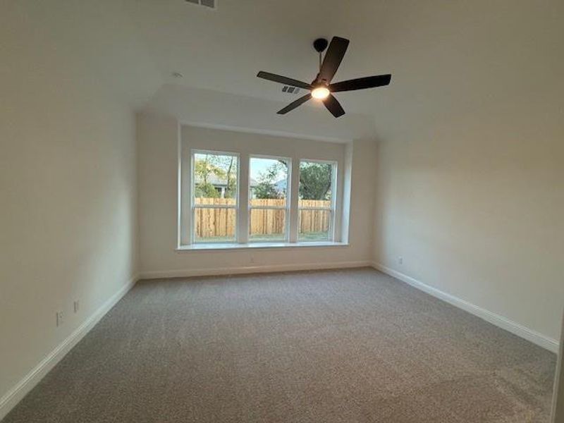 Primary Bedroom with elevated ceiling
