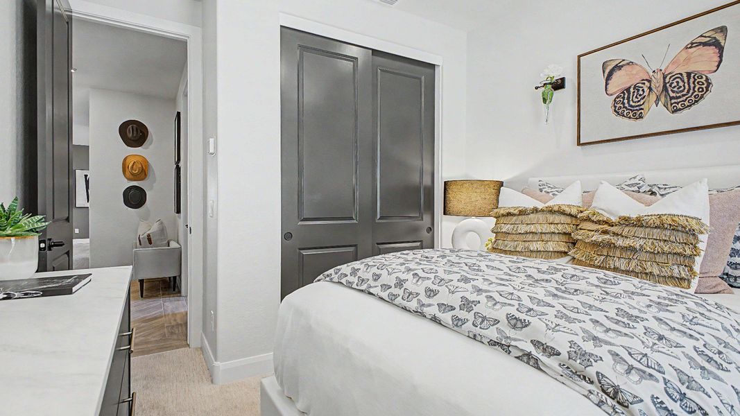Secondary bedroom with butterfly accents in this quick move-in new home by DRB Homes at Saguaro Hills at Vistancia. Secondary bedroom with butterfly accents in this quick move-in new home by DRB Homes at Saguaro Hills at Vistancia.