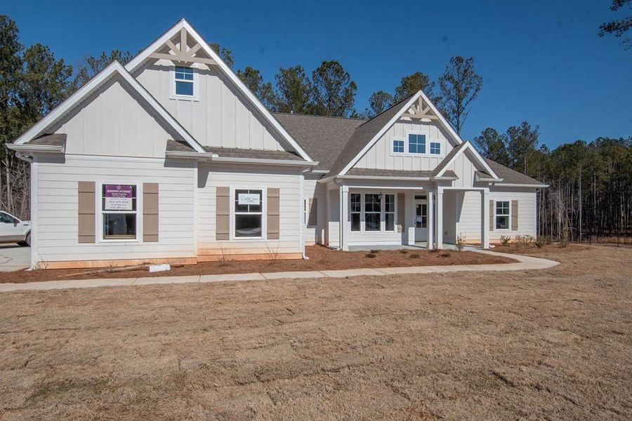 Front exterior of a new home in Highgate, Newnan, GA, highlighting curb appeal (Image 8). Front exterior of a new home in Highgate, Newnan, GA, highlighting curb appeal (Image 8).