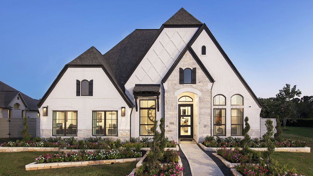 Front exterior of a new home in Trinity Falls, McKinney, TX, highlighting curb appeal (Image 23).