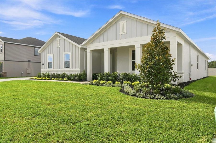 Front exterior of a new home in Willow Run, Apopka, FL, highlighting curb appeal (Image 15).