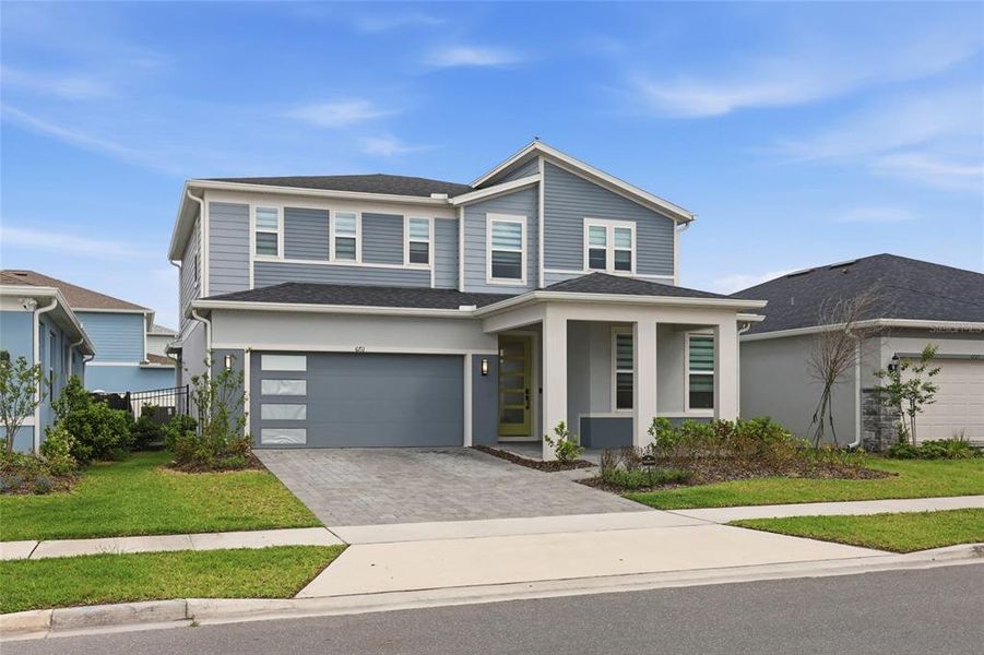 Front exterior of a new home in , Orlando, FL, highlighting curb appeal (Image 31).