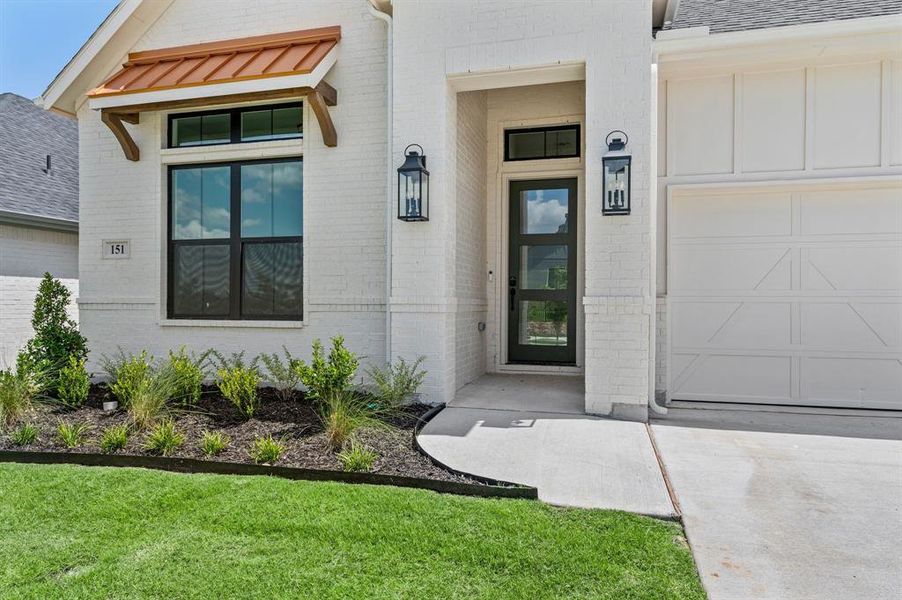 Front exterior of a new home in Parks of Aledo, Aledo, TX, highlighting curb appeal (Image 2). Front exterior of a new home in Parks of Aledo, Aledo, TX, highlighting curb appeal (Image 2).
